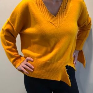 Egg yolk colored sweater with cut outs. NWT